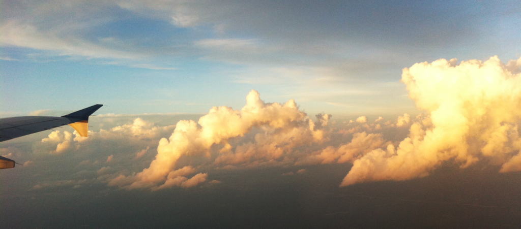 plane wingtip and clouds photo