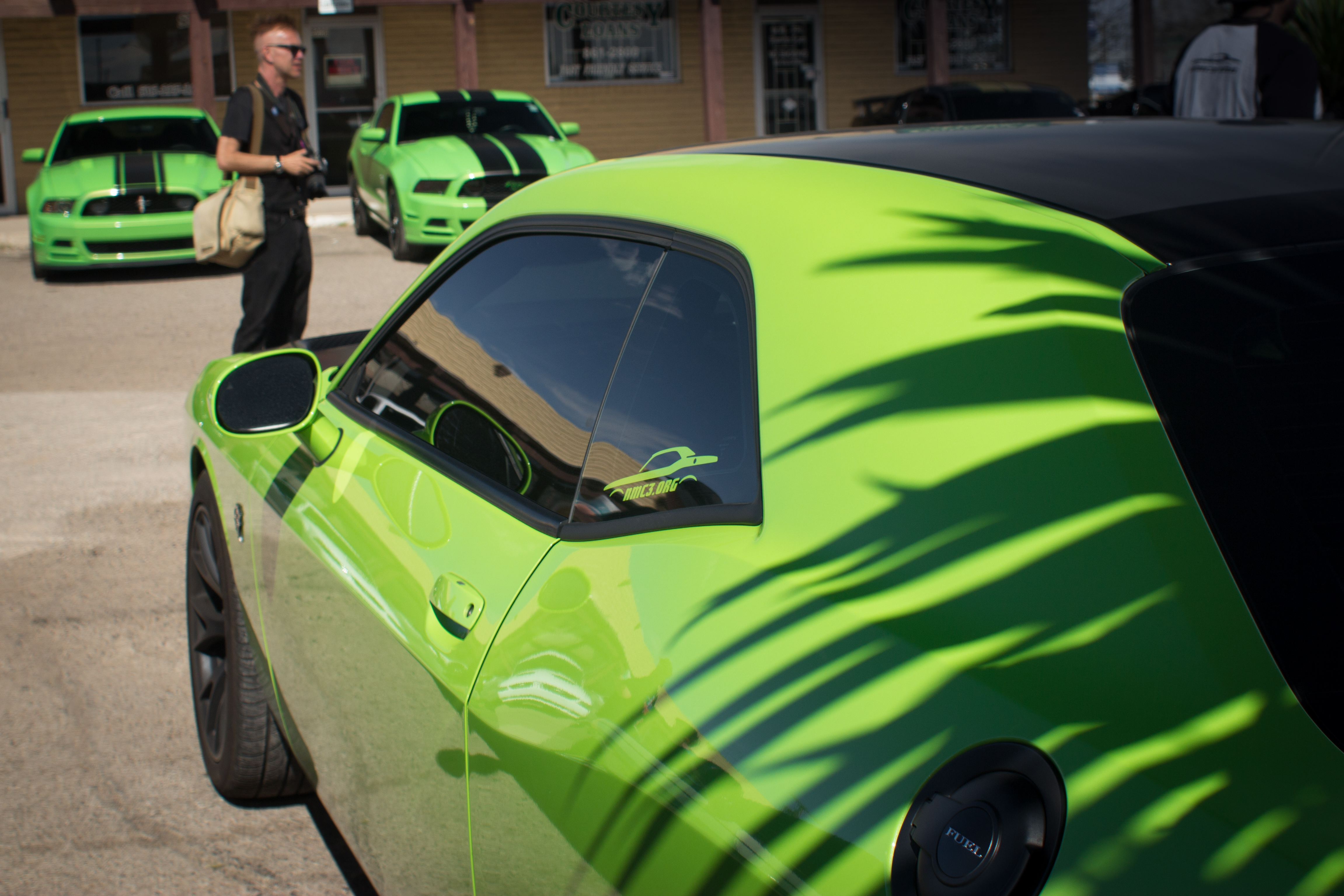 Three green cars